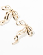 oversized stud earrings with bow detail in gold tone