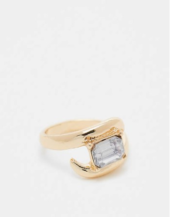 ring with wrap around crystal detail in gold tone